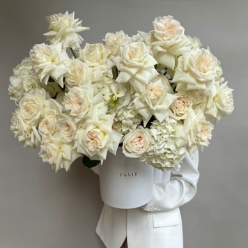 Arrangement based on hydrangea and French upside-down rose of the White O'Hara variety