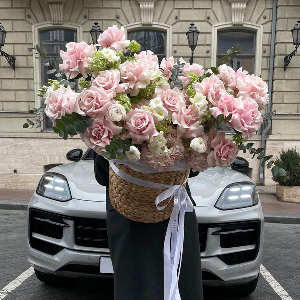 Pink floral arrangement in a basket