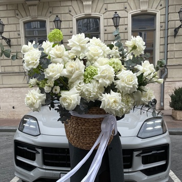 Floral arrangement in a basket in light shades